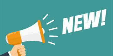 Hand hold megaphone. New. Flat style. Vector illustration